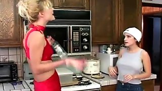 Lesbian dildo fucking in the kitchen